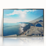 Large art print of a serene Greek landscape, in soft blue and white tones, acrylic print in a silver frame.