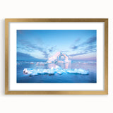 Abstract art print featuring a minimalist Greenland landscape in muted green and blue tones, framed in gold.