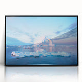 Large abstract wall art depicting a Greenlandic landscape in muted green and blue hues, framed in black acrylic.