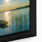 Close-up of textured black wall art featuring a colorful European scenery on a framed canvas.