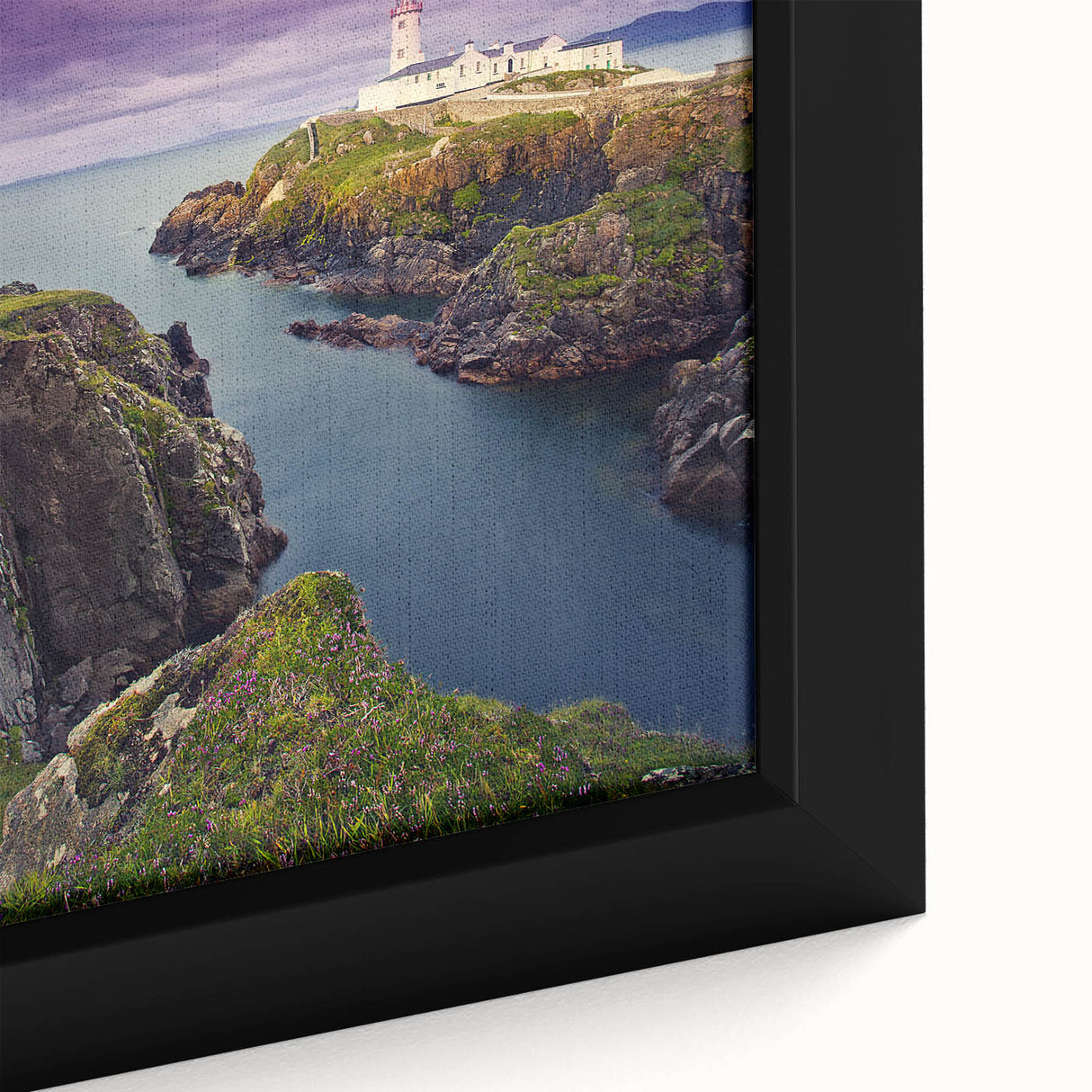 Close-up of a textured black wall art depicting a colorful Irish scenery on a framed canvas, ideal for living room decor.