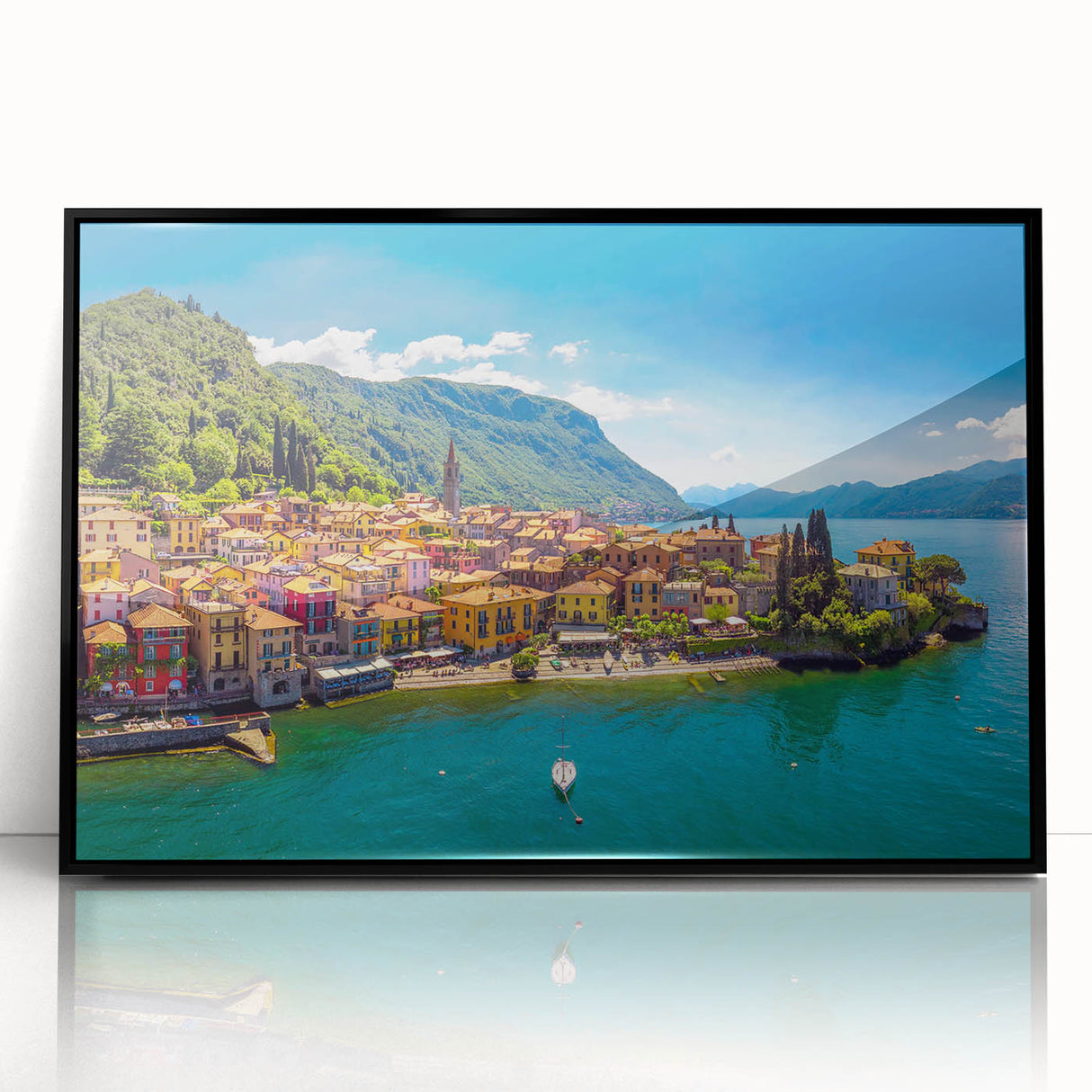 Large abstract wall art of Lake Como with muted blue and green tones, framed in black acrylic.