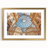 Abstract art print of Milan scenery in muted gold and blue tones on a framed canvas.