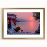 Abstract art print of the Mediterranean Sea in muted blue and white tones, framed in gold, suitable for dining room decor.