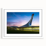 Textured abstract art print of a European landscape in muted earth tones on a framed white mat, suitable for bedroom art.