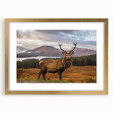 Abstract art print of a Scottish landscape in muted green and blue tones, framed in gold.