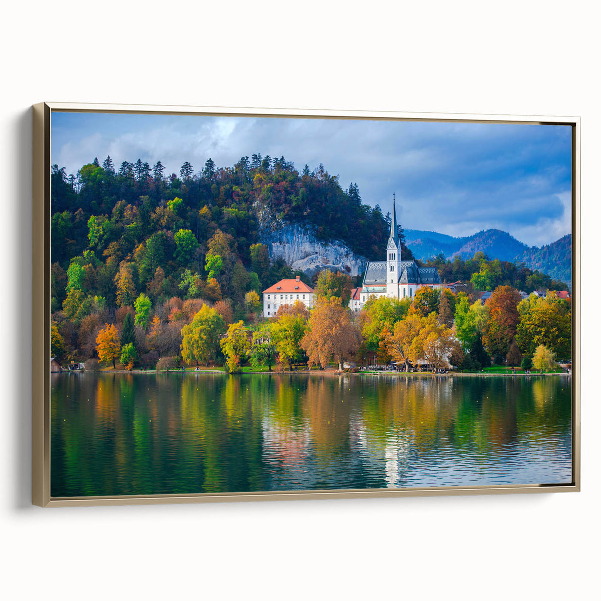 Framed canvas featuring a vintage-style landscape painting of a Slovenian scenery in muted gold and black tones.