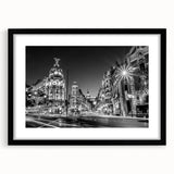 Extra large abstract art print of colorful, textured Madrid scenery on a black framed canvas, ideal for living room decor.