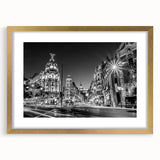 Extra large abstract art print of Madrid scenery in gold frame, featuring textured strokes in earthy tones.