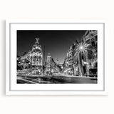 Abstract art print of Madrid skyline in muted earth tones on a framed white mat, ideal for dining room decor.