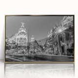 Framed acrylic print of Madrid cityscape in mid-century modernist style, featuring muted earth tones.