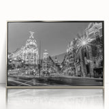 Mid-century modernist art depicting Madrid's cityscape in muted earth tones on a silver-framed acrylic print.