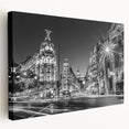 Stretched canvas depicting a vibrant Madrid cityscape in rich red and orange tones, ideal for kitchen wall art.