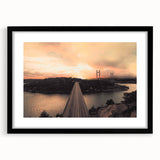 Abstract art print featuring textured, colorful art of a European scenery in a black frame with mat.