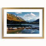 Extra large abstract art print of a textured European landscape in muted earth tones, framed in gold.