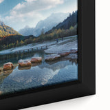 Extra large framed canvas featuring a textured depiction of a Swiss landscape in black with colorful accents.