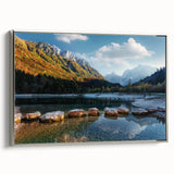 Framed canvas featuring a vintage-style landscape painting of a Swiss scenery with vibrant green fields and a distant…