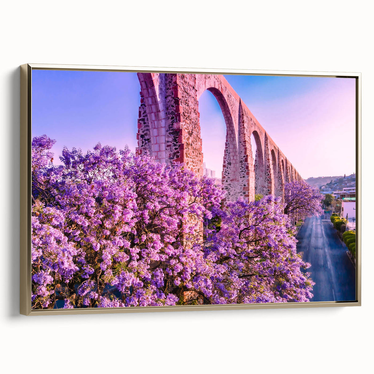 Framed canvas wall art depicting a vintage-style landscape of Guanajuato, Mexico in gold and black tones.