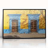 Large abstract wall art depicting a vibrant Oaxaca, Mexico scenery in mid-century modernist style, framed in black acrylic.