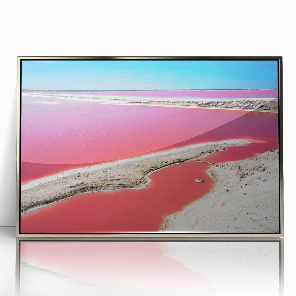 Mid-century modernist art depicting a Yucatan scenery in muted earth tones on a silver-framed acrylic.