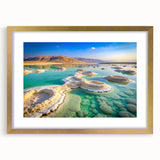 Extra large abstract art print of the Dead Sea in textured shades of blue and beige on a framed canvas.