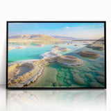 Large abstract wall art of the Dead Sea in muted blue and beige tones on a framed acrylic.