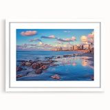 Abstract art print of Tel Aviv skyline in muted blue and gray tones on a framed white mat, ideal for dining room decor.