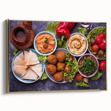 Framed canvas featuring a vintage-style landscape painting of a Middle Eastern scenery in muted gold and black tones.