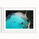 Abstract art print depicting a serene oceanic scene in muted blue and white tones, framed with a white mat.