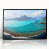 Large abstract wall art depicting the serene Bora Bora landscape in muted blue and green tones, framed in black acrylic.