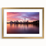 Extra large wall art featuring an abstract depiction of the Auckland skyline in textured gold and blue tones on a framed…