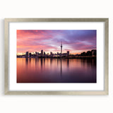 Textured abstract art print of Auckland scenery in muted blue and gray tones on a framed canvas.