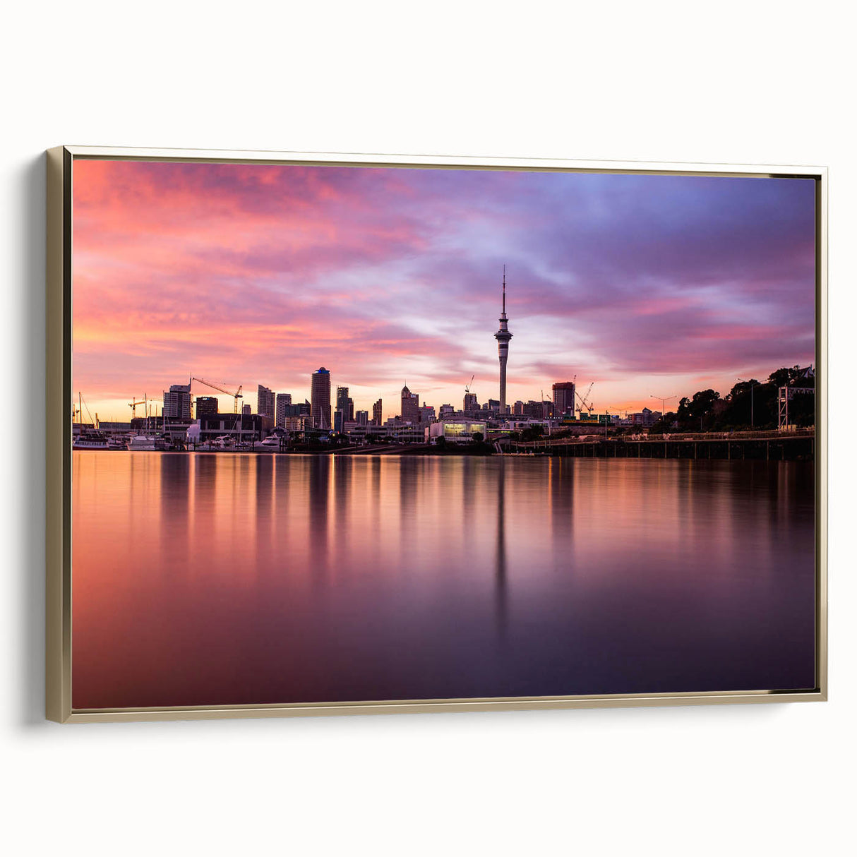 Framed canvas of Auckland landscape with vintage poster style in black and gold tones, ideal for bedroom wall art.