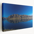 Side view of a stretched canvas featuring a serene Otago, New Zealand landscape in soft blue and green tones.