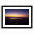 Extra large abstract art print of New Zealand's west coast in vibrant colors on a textured canvas, framed in black.