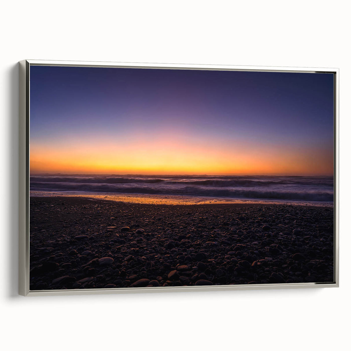 Landscape art painting of New Zealand's west coast in vibrant colors, framed in silver, ideal for living room decor.
