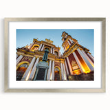 Textured art depicting an abstract scene in muted earth tones on a framed silver mat, ideal for bedroom art.