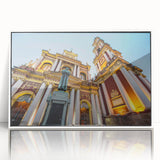 Art deco poster of an Argentine landscape in muted greens and blues, acrylic print framed in white.