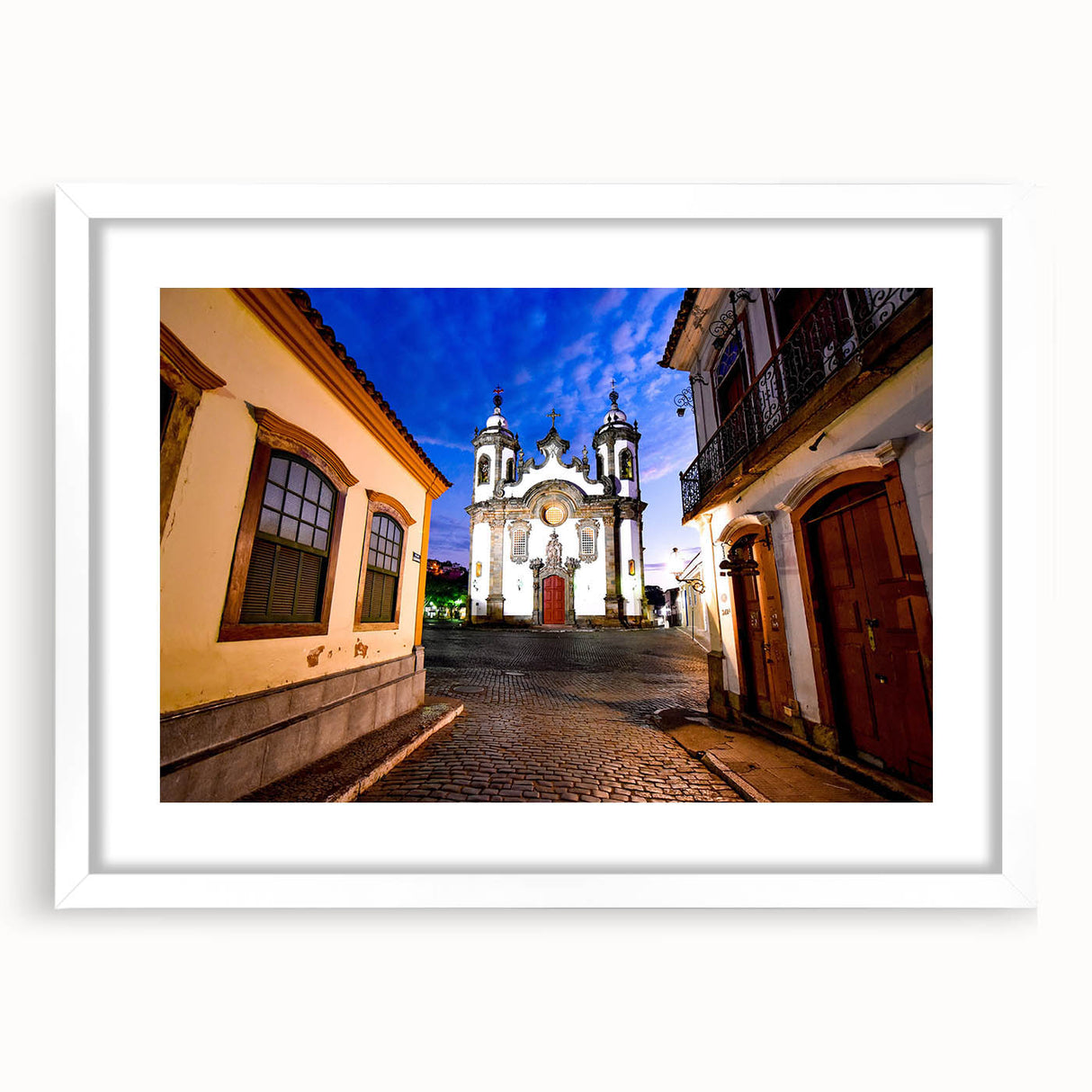 Abstract art print depicting a colorful Brazilian landscape on a white-framed mat, suitable for bedroom or dining room decor.