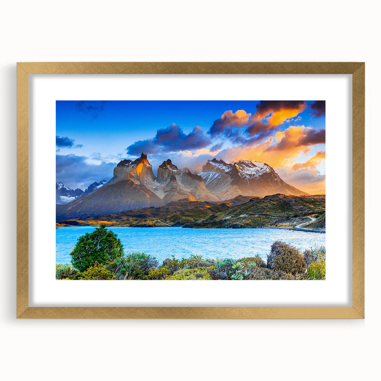 Extra large wall art featuring an abstract textured print of a South American landscape in muted earth tones, framed in gold.