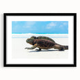 Abstract art print of Galapagos scenery in vibrant colors on a large black-framed canvas, ideal for living room decor.