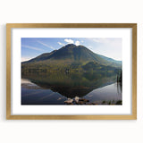 Extra large wall art featuring a textured abstract print of an Ecuadorian landscape in muted earth tones, framed in gold.