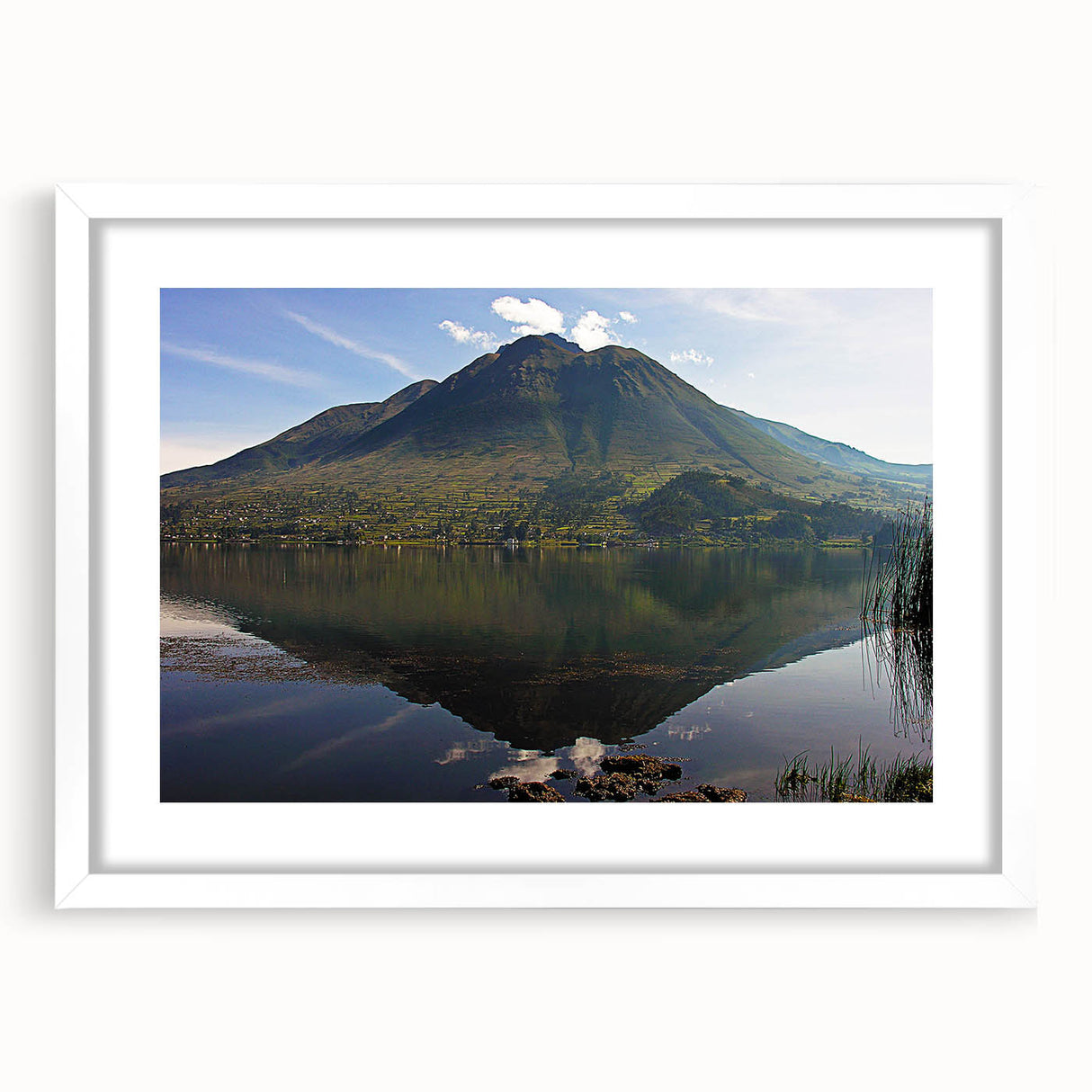 Abstract art print of South American scenery in muted earth tones on a white framed canvas.