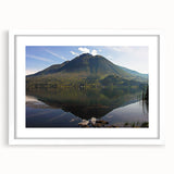 Abstract art print of South American scenery in muted earth tones on a white framed canvas.