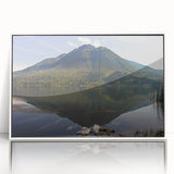 Art deco poster of an Ecuadorian landscape in muted green and blue tones, acrylic print framed in white.