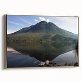 Framed canvas featuring a vintage-style landscape painting of a South American scenery in black and gold tones.