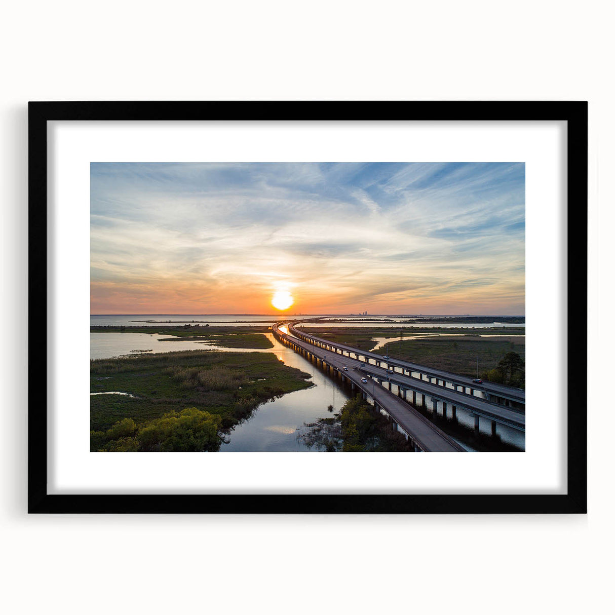 Abstract art print featuring vibrant, colorful textures, framed in black, ideal for living room decor.