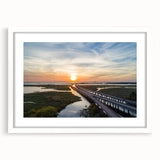 Abstract art print featuring swirling patterns in blue and gray tones on a white framed canvas, ideal for dining room decor.