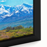 Close-up of extra large framed canvas featuring a textured depiction of Denali, Alaska in black with colorful accents.