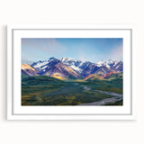Abstract art print of Alaskan scenery in muted blue and gray tones on a framed white mat, ideal for dining room decor.